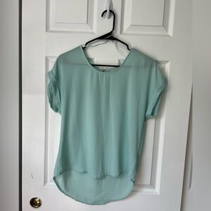Teal sheer women’s top with zipper detail on back